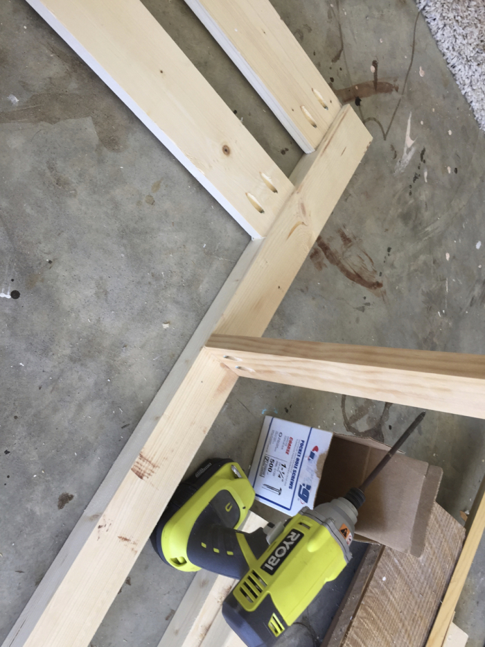 DIY Toddler Bed Rail Free Plans Built For Under 15   DIY Toddler Bed Rail Step 3 Screwing 700x933 