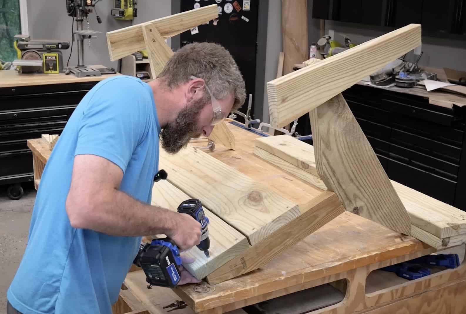 Driving a slat into the leg assembly with an impact driver