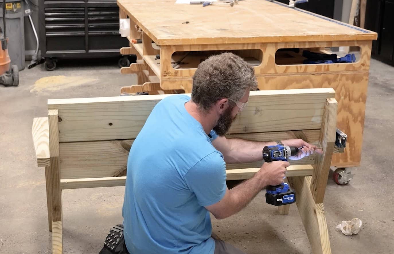 Checking the arm rest with a level before securing it to the back support