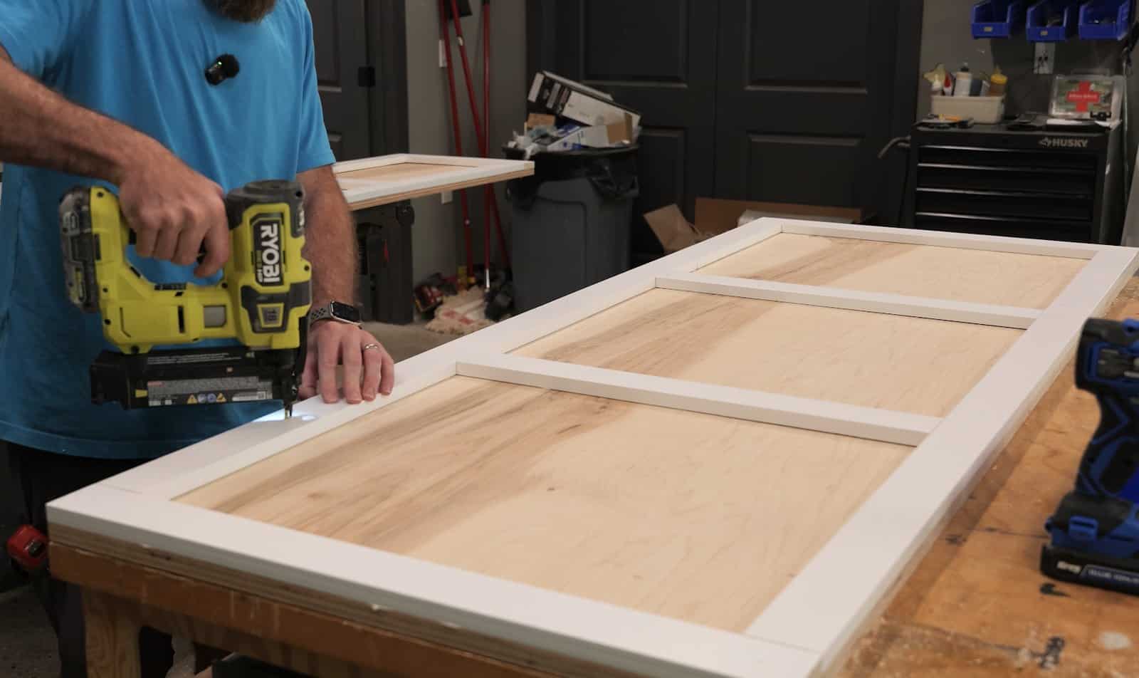 Brad nailing the face frame onto the plywood headboard panel