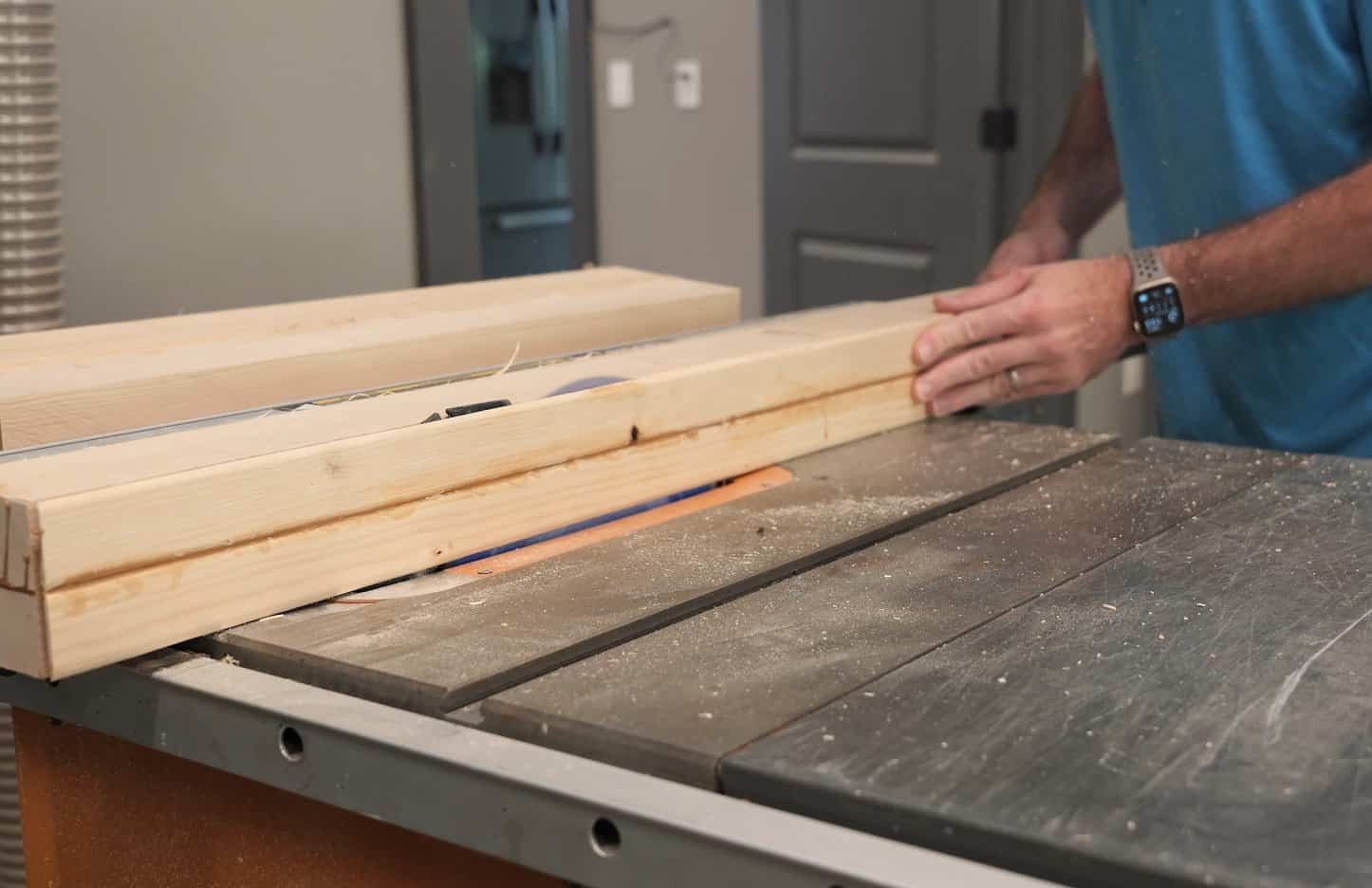 Ripping a glued up 2x4 leg blank square on the table saw