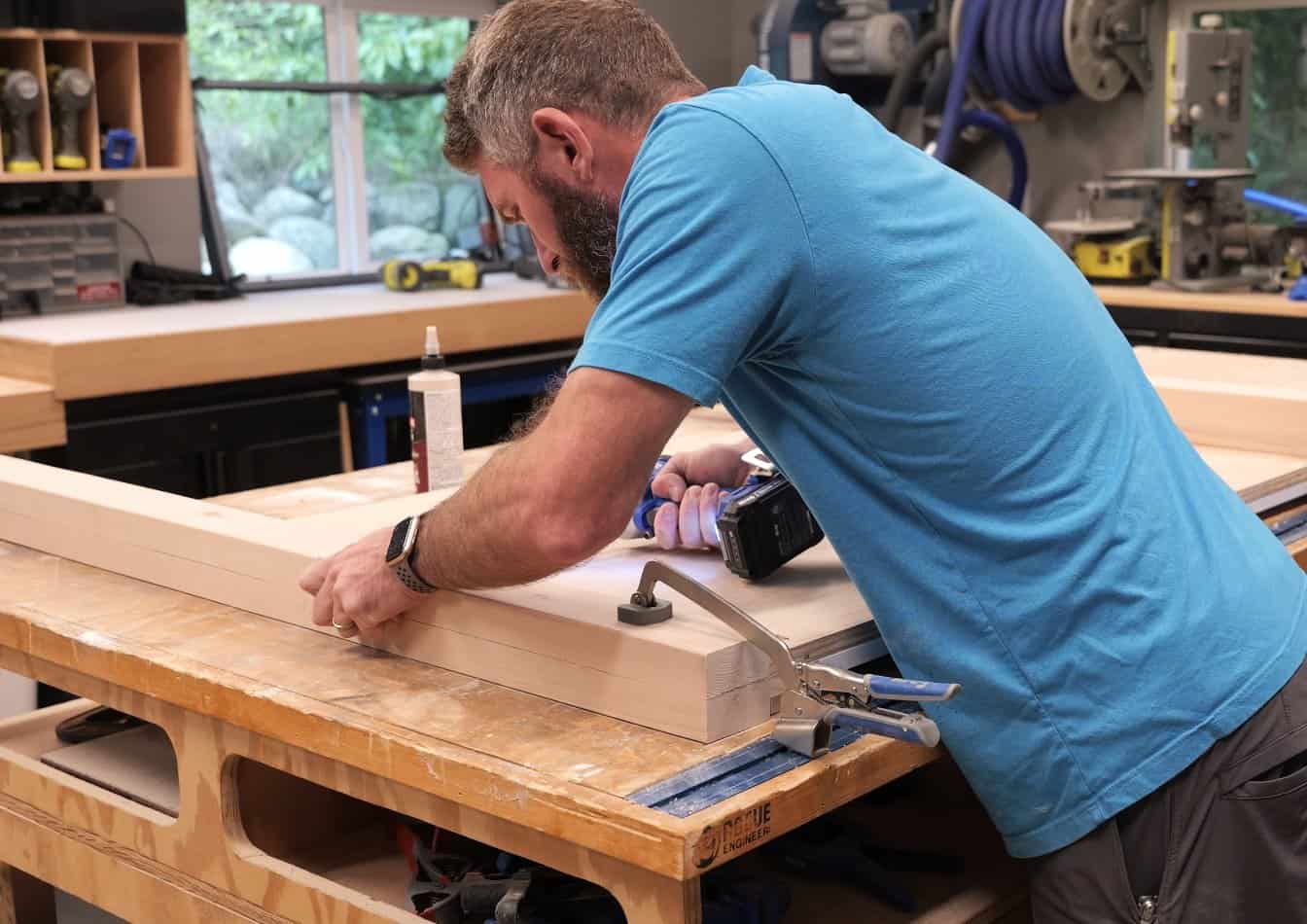 Clamping a leg to the headboard panel and driving pocket screws to join them