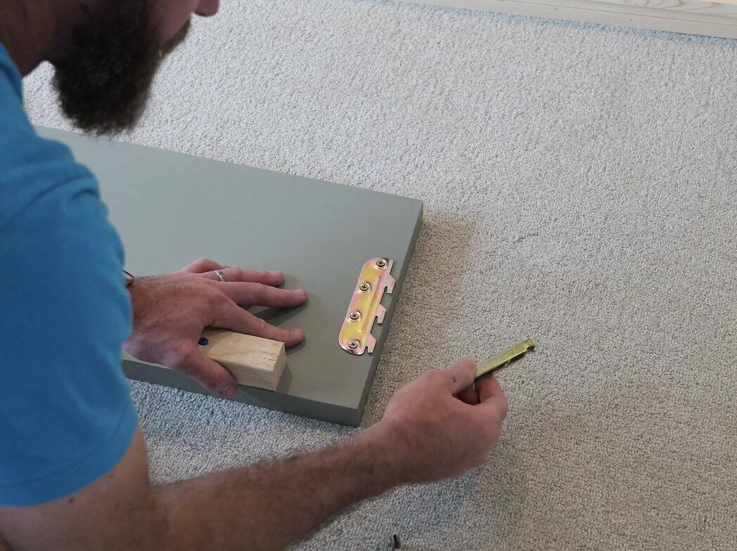 Marking the bed rail bracket position on the end of a side rail