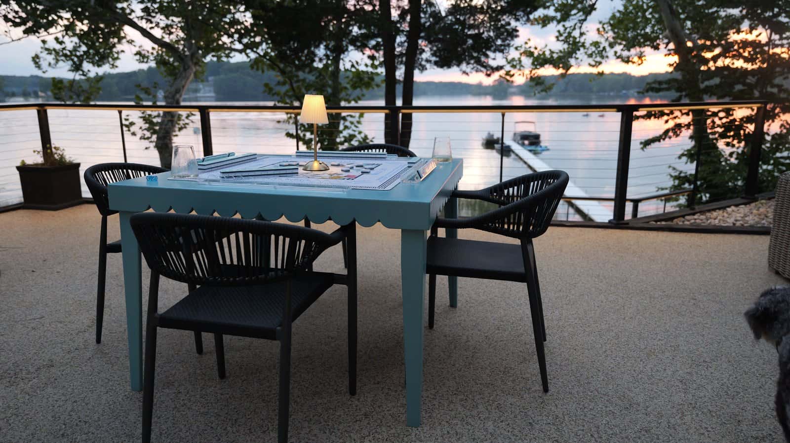 Square DIY game table with four chairs, one on each side, built from plywood and pine