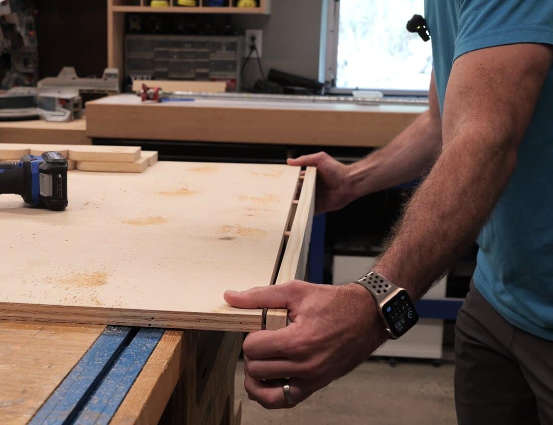 Apron joined flush to a plywood table top with loose tenons