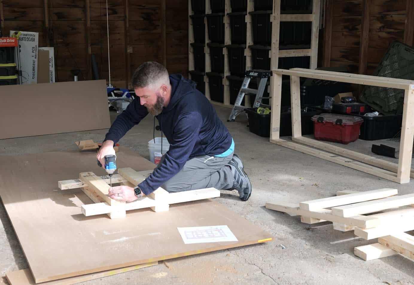 Screwing runners to both faces of a middle ladder for the tote workbench