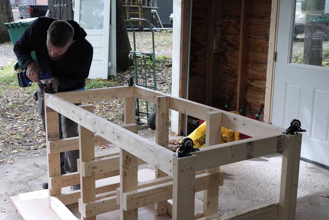 Mounting a locking caster on the upside down workbench frame