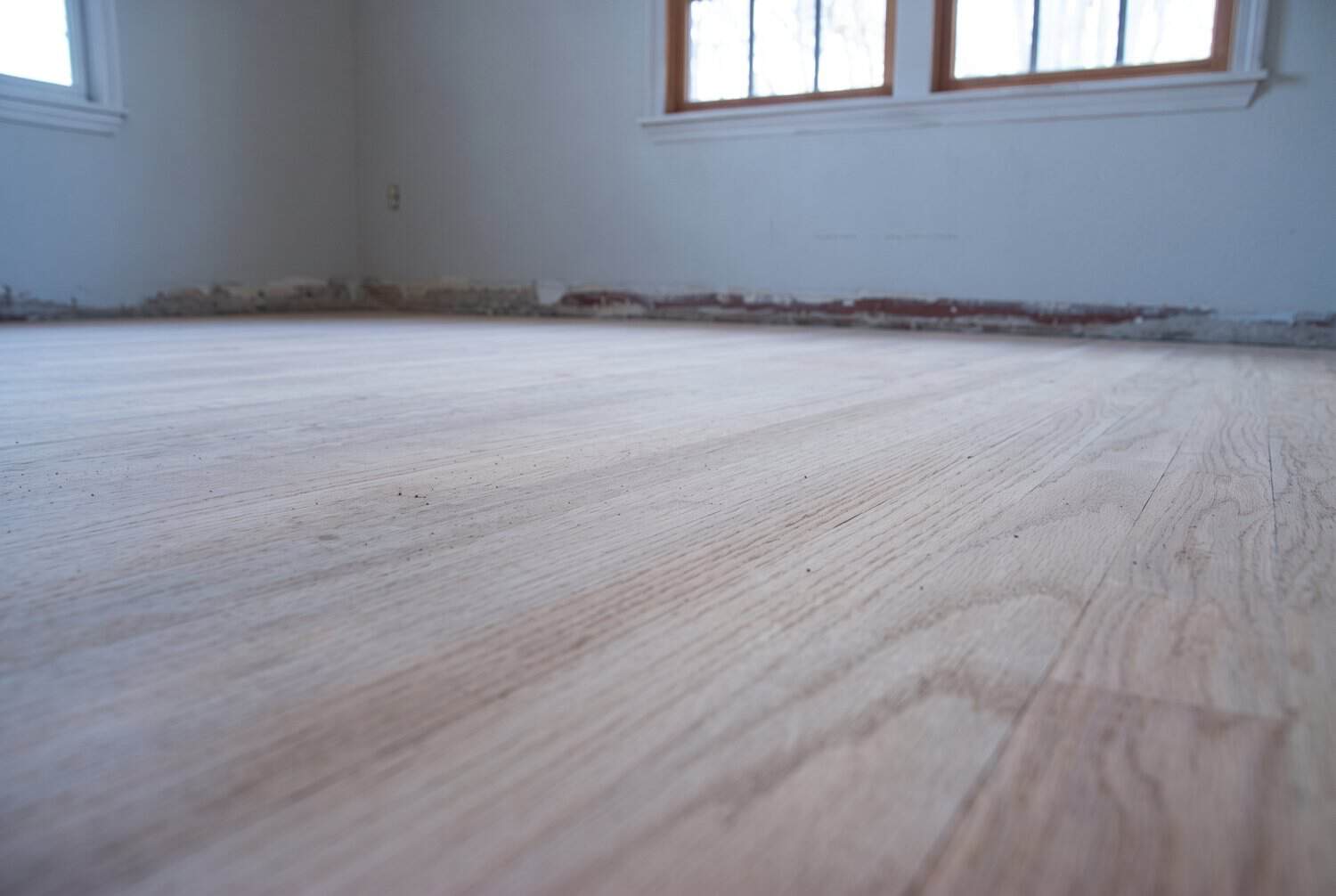 Bare oak floor after the 100-grit pass