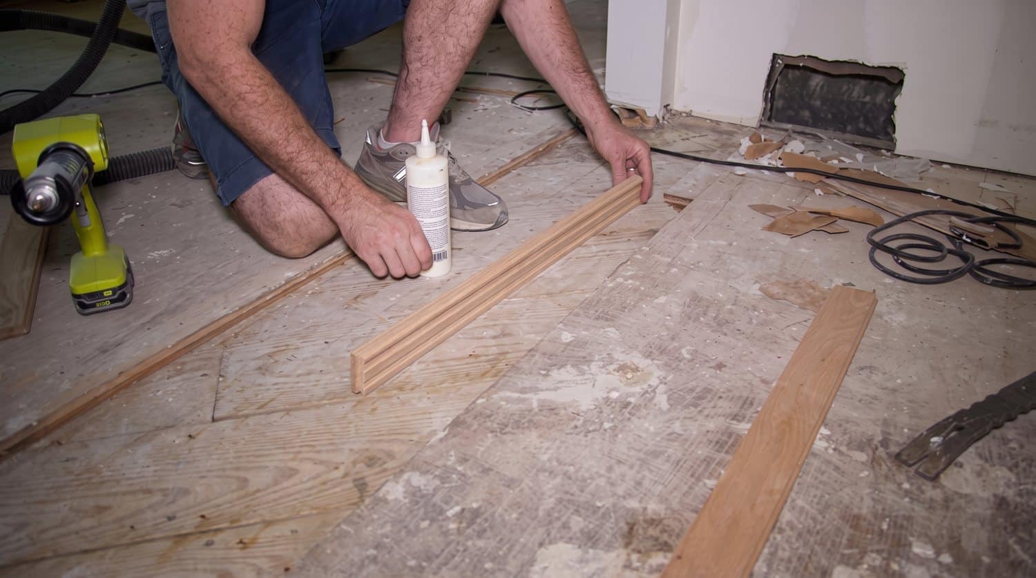 Installing new oak boards with construction adhesive and tongue-and-groove glue